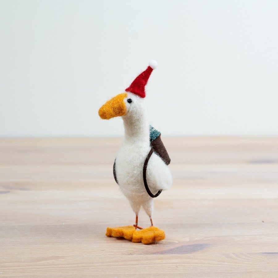 Add a touch of festive charm to your collection with this delightful felt goose