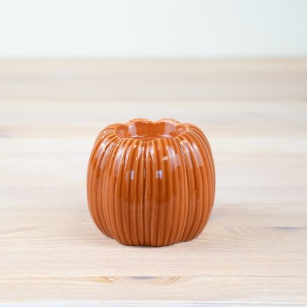 Illuminate your home with the vibrant charm of our Pumpkin Candle Holder, a perfect autumn addition to any room.
