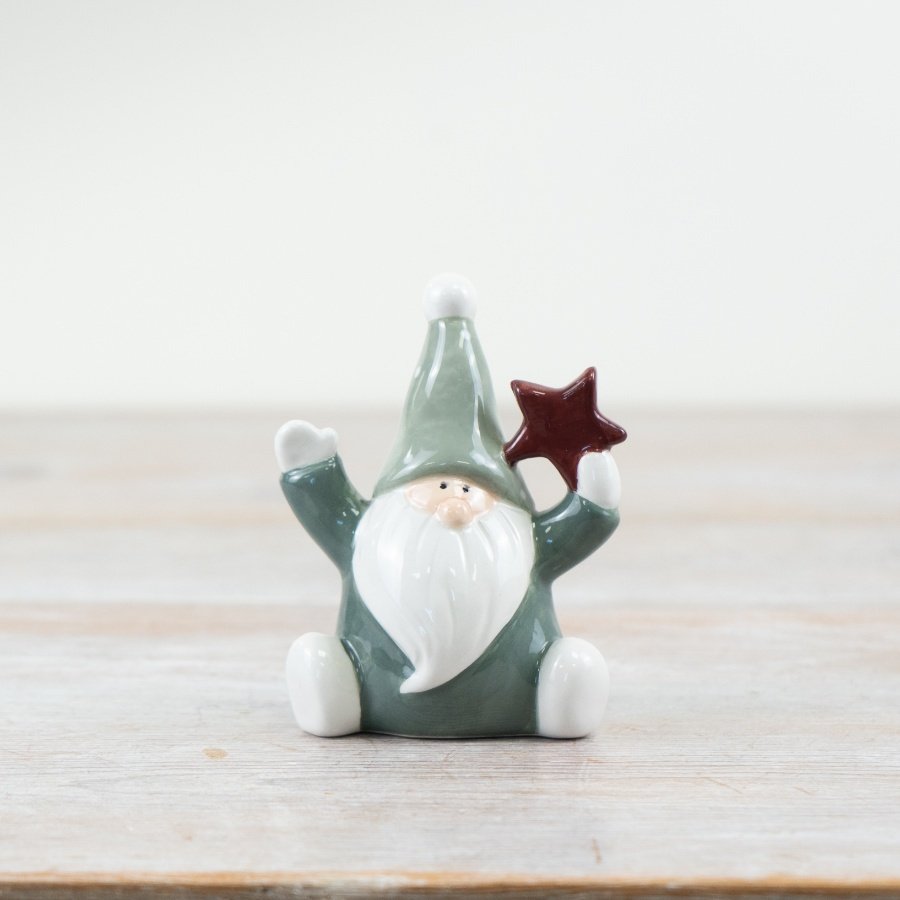 "Bring festive cheer with our adorable "Green Santa with Star" holiday ornament.