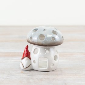 Introduce a touch of nature to your Christmas collection with this charming grey ceramic mushroom candle house.