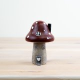 Add a touch of whimsy to your home with our charming Red Mushroom House Ornament