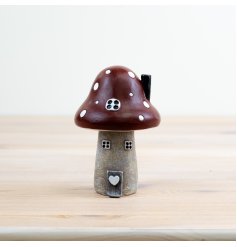 Add a touch of whimsy to your home with our charming Red Mushroom House Ornament