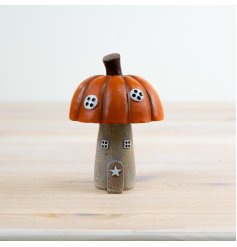 Add some autumnal charm to your home with the charming Pumpkin Roof House Ornament