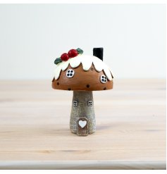 Add a dash of whimsy to your home decor with our charming Pudding Roof House Ornament.