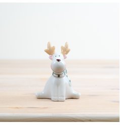 Deck your halls with this darling reindeer sitting decoration, adding festive cheer to your home decor. 