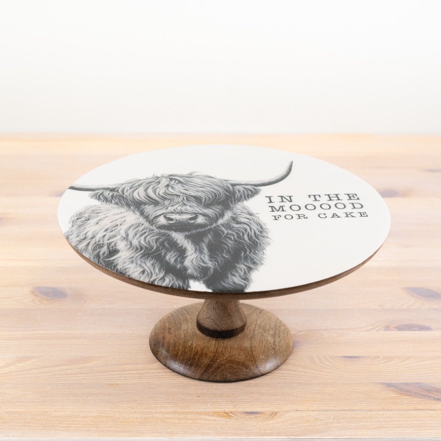 Add rustic charm to your table with our elegant highland cow serving plate,