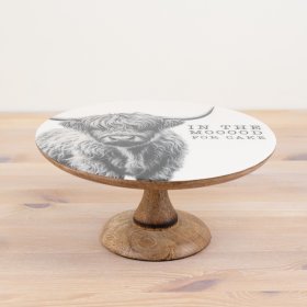 Cake serving plate featuring a unique blend of enamel and wood for a stylish finish