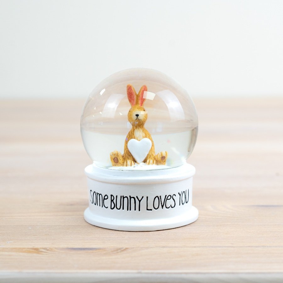 Add a touch of Easter cuteness to your decor with this charming snow globe