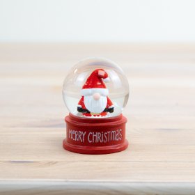 Captivate with this mini snowglobe in classic holiday hues, perfect for enchanting winter scenes!