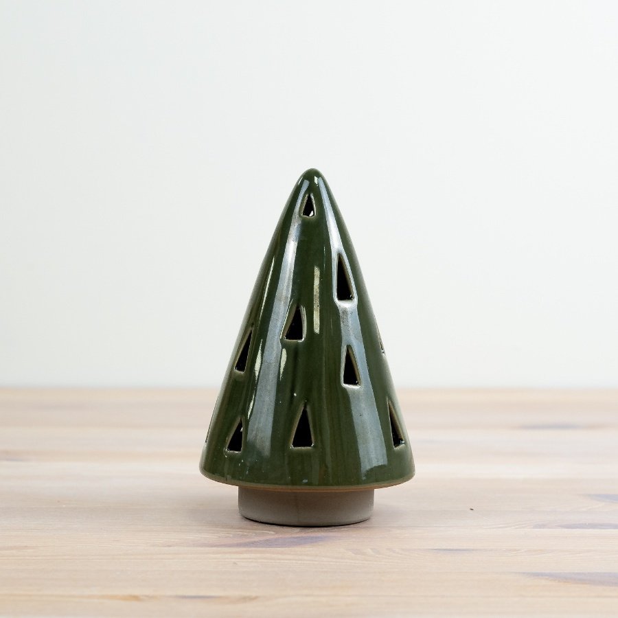 Add a touch of woodland charm to your festive collection with this beautifully crafted green glazed tree.