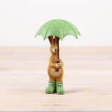 charming standing rabbit figurine with umbrella and matching green wellies 