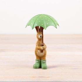 Delightful rabbit figurine with an umbrella and adorable green boots,