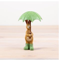 charming standing rabbit figurine with umbrella and matching green wellies 