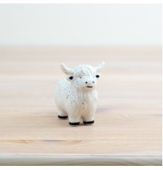 "Miniature elegance for your home with our porcelain cow figurine.