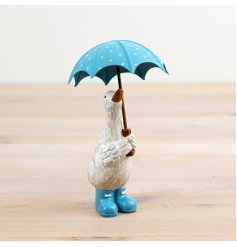 Step into a world of whimsy with our charming "Duck Holding Umbrella" figurine -