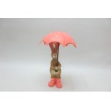 Add a dash of whimsy to your home decor with our Rabbit Holding Umbrella figurine 