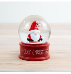 A sweet Christmas snow globe with a Santa icon in the middle surrounded by snow. 