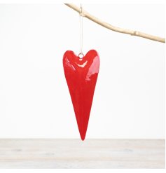 A glossy hanging heart decoration in a rich red colour. A classic decoration with string hanger.