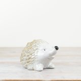 A stylish hedgehog decoration in natural colours with a rich glossy glaze.