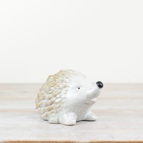 A stylish porcelain hedgehog ornament with a rustic finish and rich autumnal glaze. 