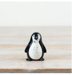 Adorn your home with a touch of whimsy with our charming penguin ornament. 