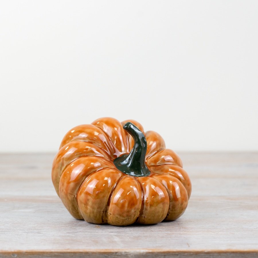 Elevate your home's charm and style with our elegant Pumpkin Ornament.