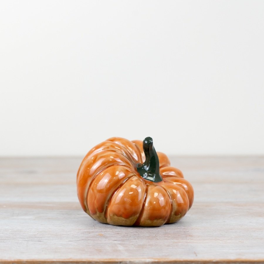 Add a touch of elegance to your decor with a glazed pumpkin ornament.