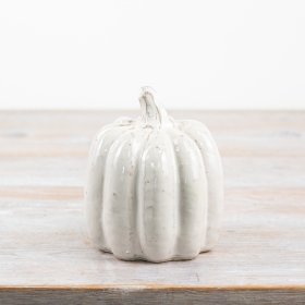 A beautifully glazed pumpkin with a smooth, shiny, and glossy finish.