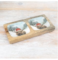 A colourful Christmas snack tray featuring a snow scene highland cow design. 