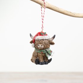 Introducing our charming Highland Cow hanging decoration, adorned with a festive green & red scarf and a Christmas hat