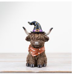 A spooky resin highland cow ornament complete with a witches hat and scarf. Great for adding some spooky country charm.