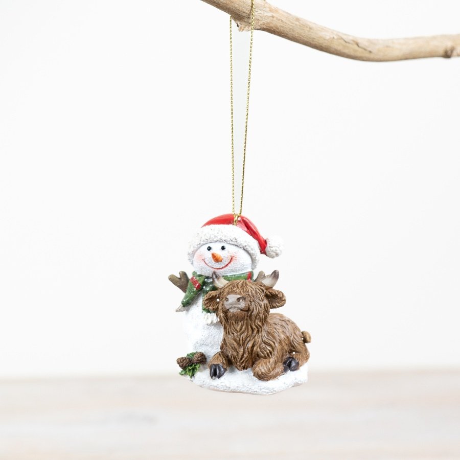 Add a touch of rustic charm to the home this holiday season with our delightful hanging snowman and highland cow decorat