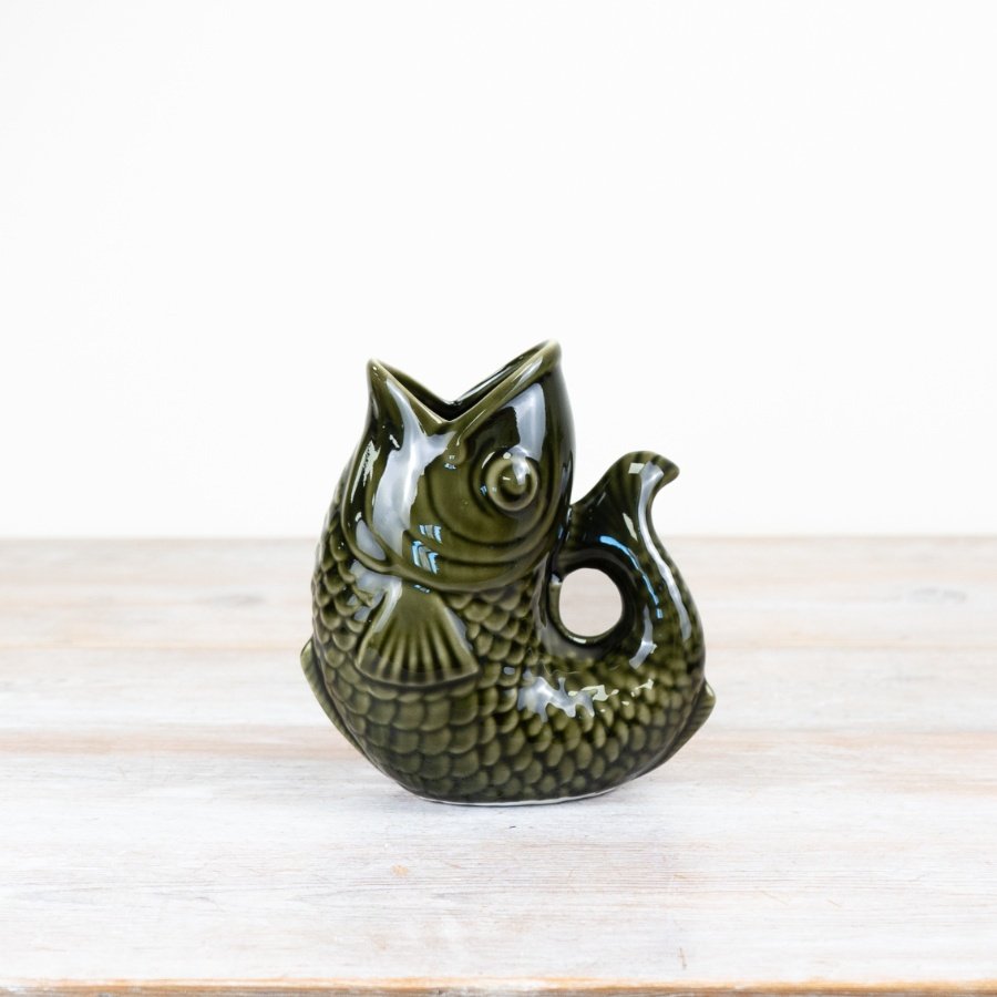 Add an element of aquatic charm to your space with our dark green ceramic fish jug.