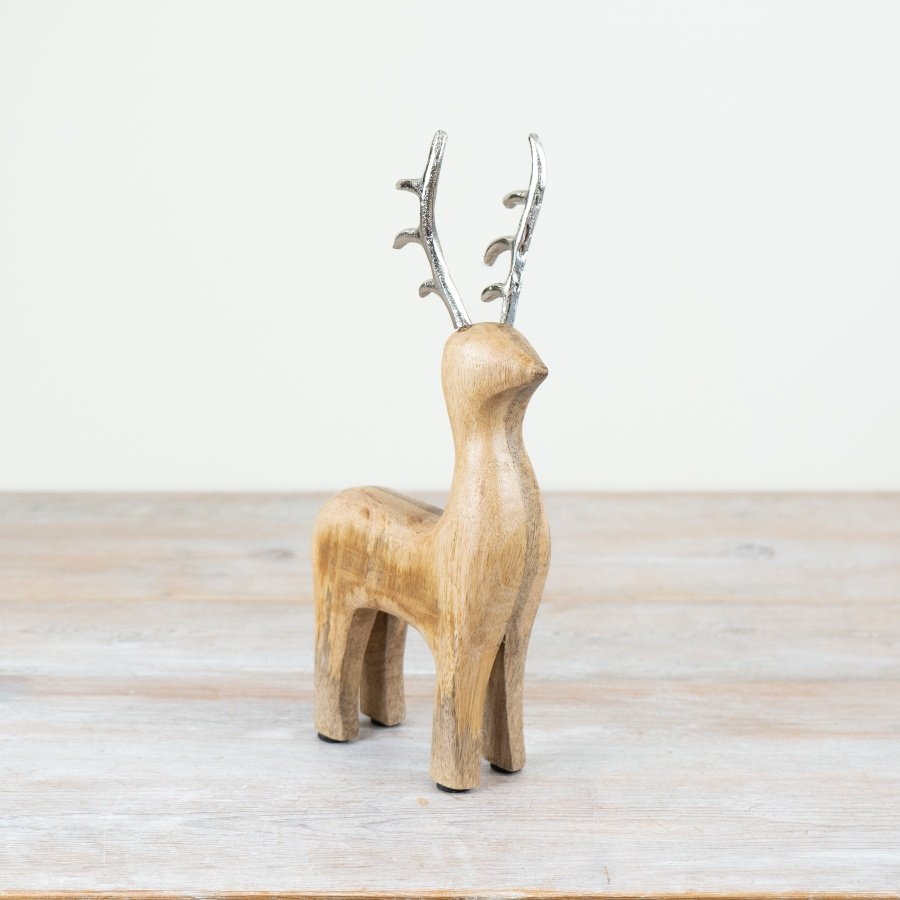 Add a touch of sophistication to any festive decor with our 30cm wooden reindeer featuring sleek aluminium antlers