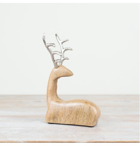 Introduce a touch of festive charm to any holiday decor with this beautifully crafted wooden reindeer