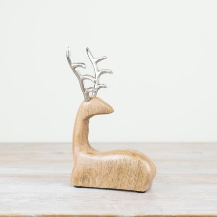 Introduce a touch of festive charm to any holiday decor with this beautifully crafted wooden reindeer