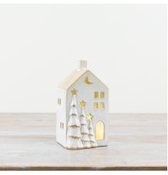 An elegant white ceramic LED house featuring 3D trees with a painted gold trim