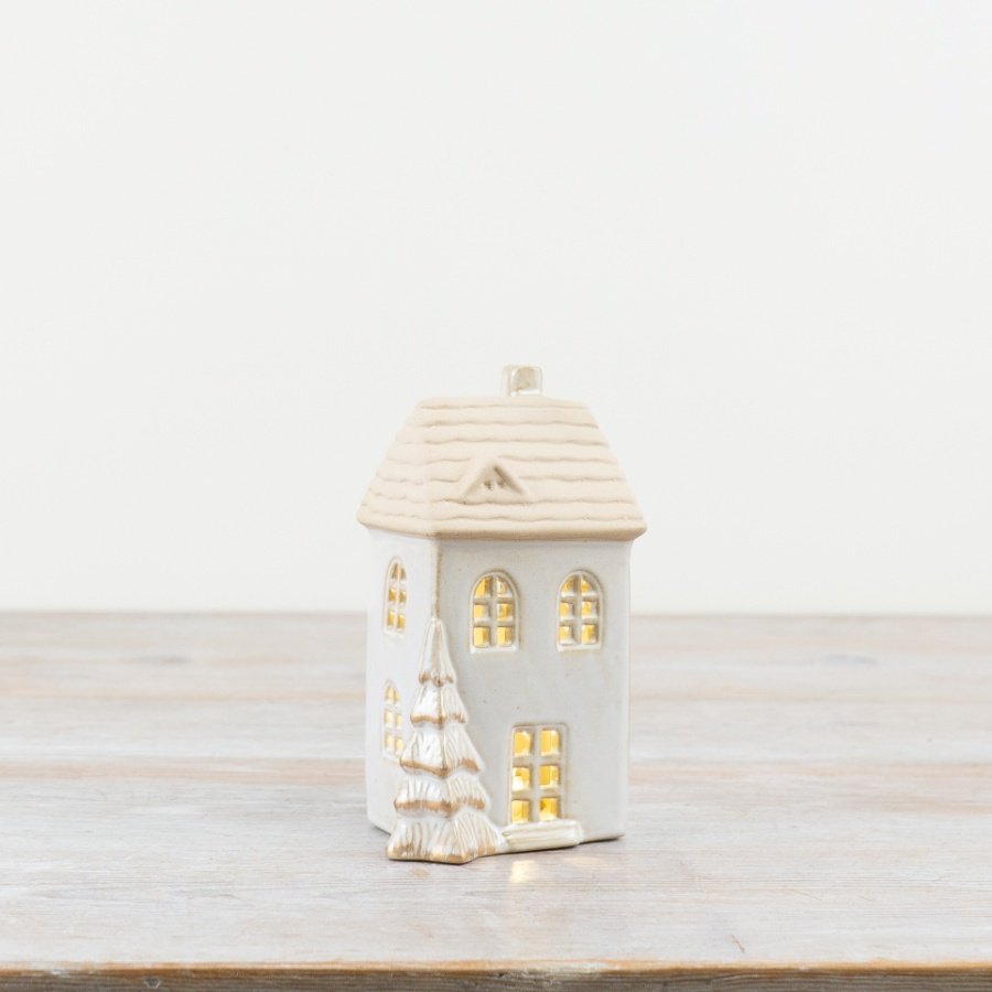  Add a warm and inviting touch to the home with this charming LED ceramic house