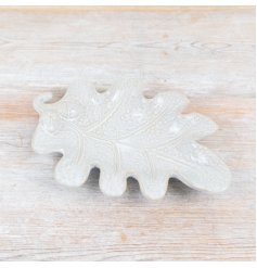 Bring the beauty of nature into your home with our Stoneware White Leaf Plate