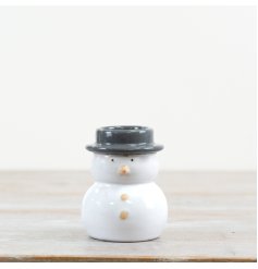 A chic snowman t-light holder with simple and stylish details. 