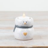 A speckled snowman t-light holder in natural white and grey colours. A cute and unique seasonal decoration. 