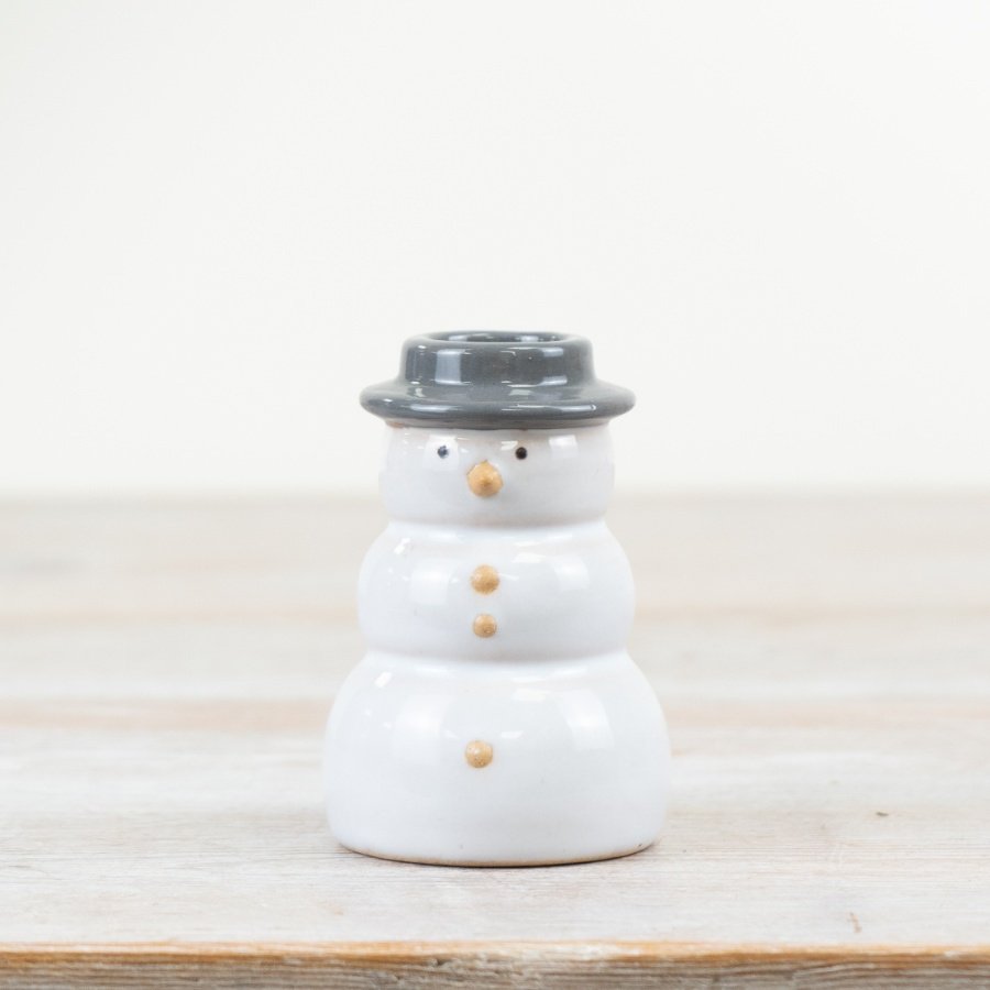 This snowman candle holder is both chic and stylish with a grey and white natural glaze. 