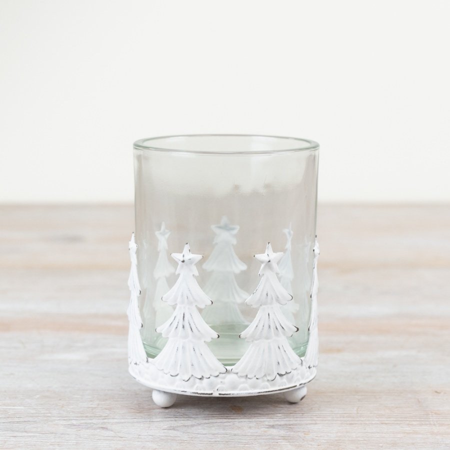 Add a charming touch to your decor with this rustic candle holder featuring star-topped trees and a glass insert. 