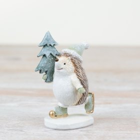 This charming hedgehog glides on ice while cradling a festive Christmas tree.