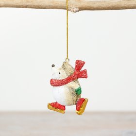 Our charming ice-skating hedgehog ornament, complete with a shimmering red scarf and skates. 