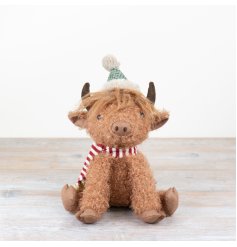 Add a touch of quaint charm to your space with our Sitting High Land Cow figurine,