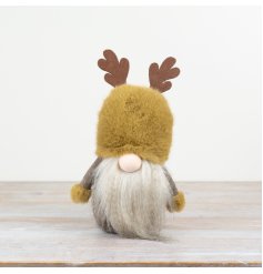 A rustic woodland gonk with antlers. In a rich and earthy palette of ochre, brown and cream hues. 