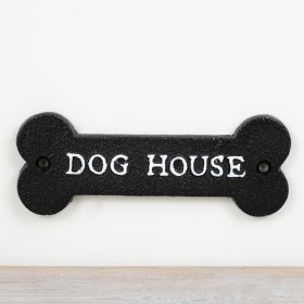 Adorable cast iron sign featuring a dog design.