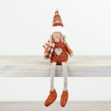 An adorable autumnal sitting doll in a burnt orange outfit complete with a scarf and farisle hat. 
