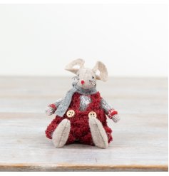 An adorable little sitting fabric mouse complete with deep red dungarees.